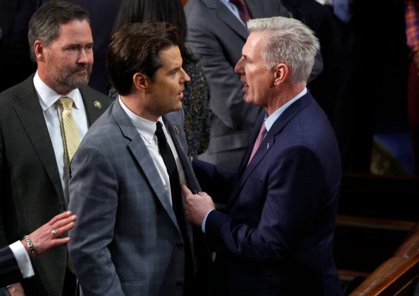 WASHINGTON, DC - JANUARY 06: U.S. House Republican Leader Kevin McCarthy (R-CA) (L) talks to Rep.-elect Matt Gaetz (R-FL) in the House Chamber after Gaetz voted present during the fourth day of voting for Speaker of the House at the U.S. Capitol Building on January 06, 2023 in Washington, DC. The House of Representatives is meeting to vote for the next Speaker after House Republican Leader Kevin McCarthy (R-CA) failed to earn more than 218 votes on several ballots; the first time in 100 years that the Speaker was not elected on the first ballot. (Photo by Chip Somodevilla/Getty Images)