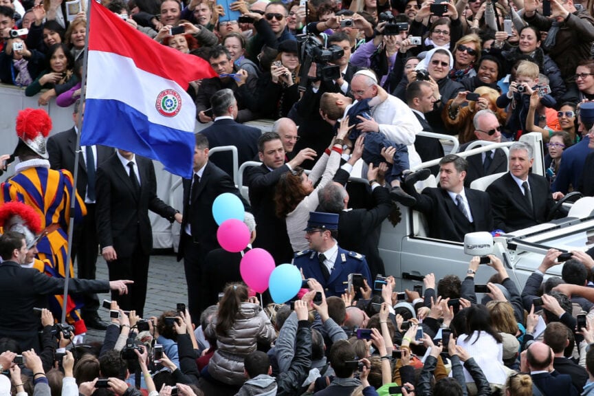 VATICAN CITY, VATICAN - MARCH 31: Pope Francis embraces a boy prior to his first 'Urbi et Orbi' blessing from the balcony of St. Peter's Basilica during Easter Mass on March 31, 2013 in Vatican City, Vatican. Pope Francis delivered his message to the gathered faithful from the central balcony of St. Peter's Basilica in St. Peter's Square after his first Holy week as Pontiff. (Photo by Franco Origlia/Getty Images)