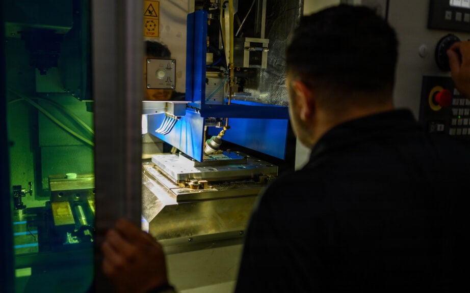 Civilian contractor Rogelio Jacobo Martinez operates the ADDITEC Hyper X 3D printer in the hangar bay of Nimitz-class aircraft carrier USS Theodore Roosevelt (CVN 71) in the Pacific Ocean enroute to participate in Exercise Rim of the Pacific 2026, June 17, 2026. Thirty nations, over 30 surface ships, five submarines, 15 national land forces, more than 206 aircraft and 30,000 personnel are participating in RIMPAC in and around the Hawaiian Islands, June 24 to July 31. The world's largest international maritime exercise, RIMPAC provides a unique training opportunity while fostering and sustaining cooperative relationships among participants critical to ensuring the safety of sea lanes and security on the world's oceans. RIMPAC 2026 is the 30th exercise in the series that began in 1971. (U.S. Navy photo by Mass Communication Specialist Seaman Tyler Harstad)